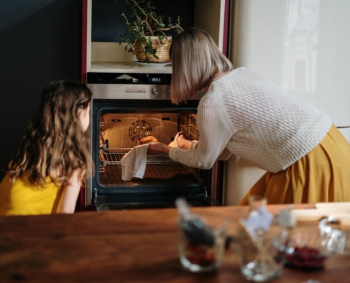 woman using the oven